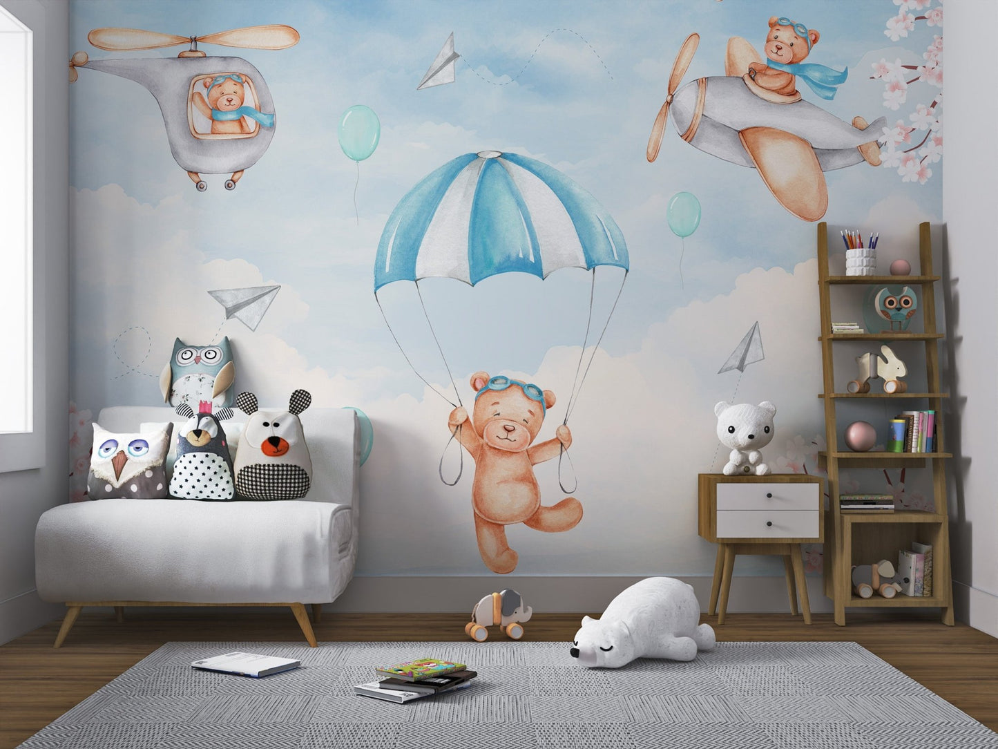 Nursery wall mural featuring a teddy bear in a helicopter with pink blossoms.