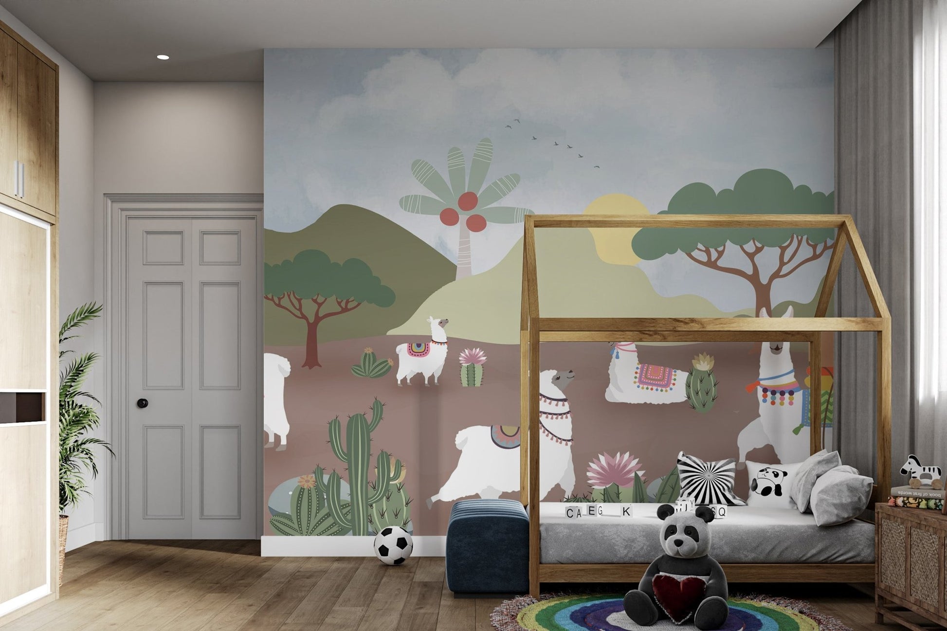 Illustrative llama wall mural with saguaro cactus and sun graphics.