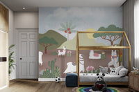 Illustrative llama wall mural with saguaro cactus and sun graphics.
