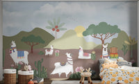 Desert landscape wall mural featuring llamas in colorful saddles for bedroom.