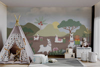 White llamas walking through a green desert valley wall mural in playroom.