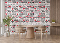 Graphic love slogan wall mural wallpaper in crisp contrast colors.