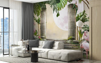 Exotic jungle paradise wall mural behind a grey sofa in a brightly lit apartment living room.