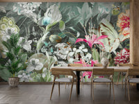 Dining room wooden table set against dark green oasis wall mural background.