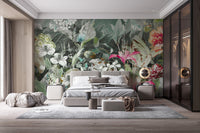 Bedroom featuring grey bedding and dark botanical floral wall mural.
