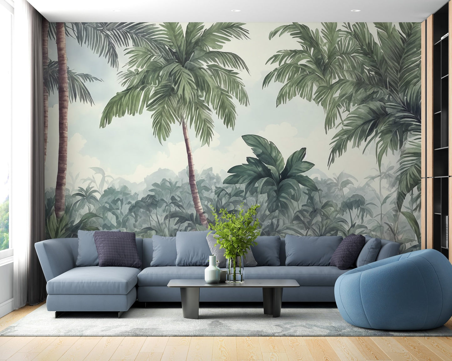 Large scale tropical woodland wall mural in living room with blue sectional sofa and coffee table.