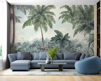 Large scale tropical woodland wall mural in living room with blue sectional sofa and coffee table.