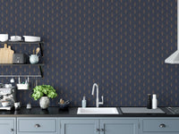 Kitchen backsplash area featuring a dark blue patterned wallpaper with white cabinetry.