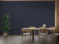 Dining room wall decor using navy and gold Art Deco wallpaper behind wooden furniture.