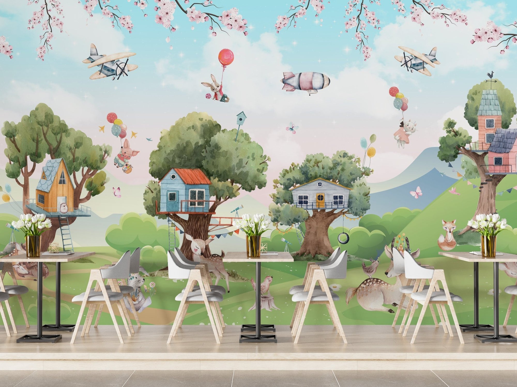 Commercial cafe with small tables and a cartoon animal wall mural.