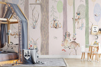 Playful woodland animal wall mural behind a grey canopy bed and wooden toys.