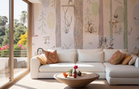 Large living room wall mural with forest illustrations behind a white sectional sofa.