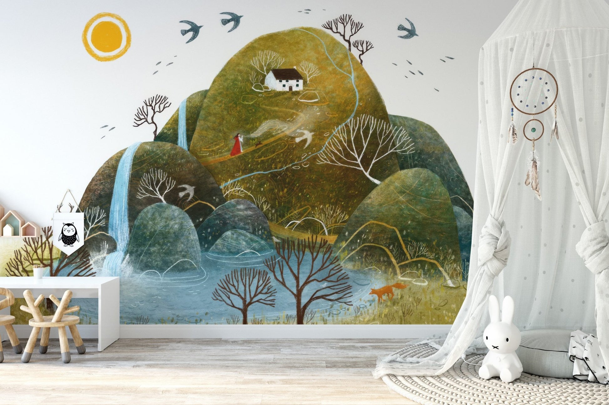 Storybook hillscape wall mural in earthy green and blue tones.