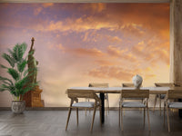 Dining room setting with a skyline sunset themed wall mural.