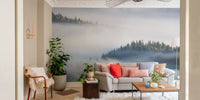 Living room with misty forest wall mural and neutral furniture.