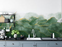 Kitchen counter with a sage green watercolor mountain wall mural.