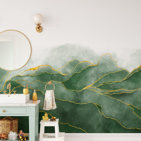 Bathroom mirror with green marble mountain wall mural and gold accents.