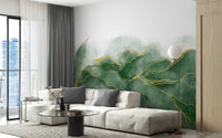 Open plan living space with a large lush green marble wall mural.