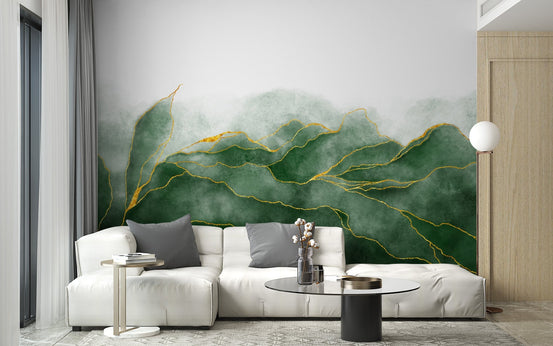 Minimalist white sofa in front of a green watercolor mountain wall mural.