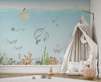 Colorful wall art mural with marine life and a submarine journey.
