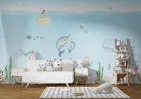 Submarine-themed mural with adorable marine friends for nursery walls.
