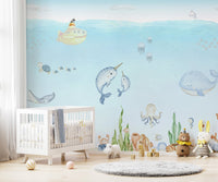 Whimsical underwater mural with marine friends and a submarine for toddler room.
