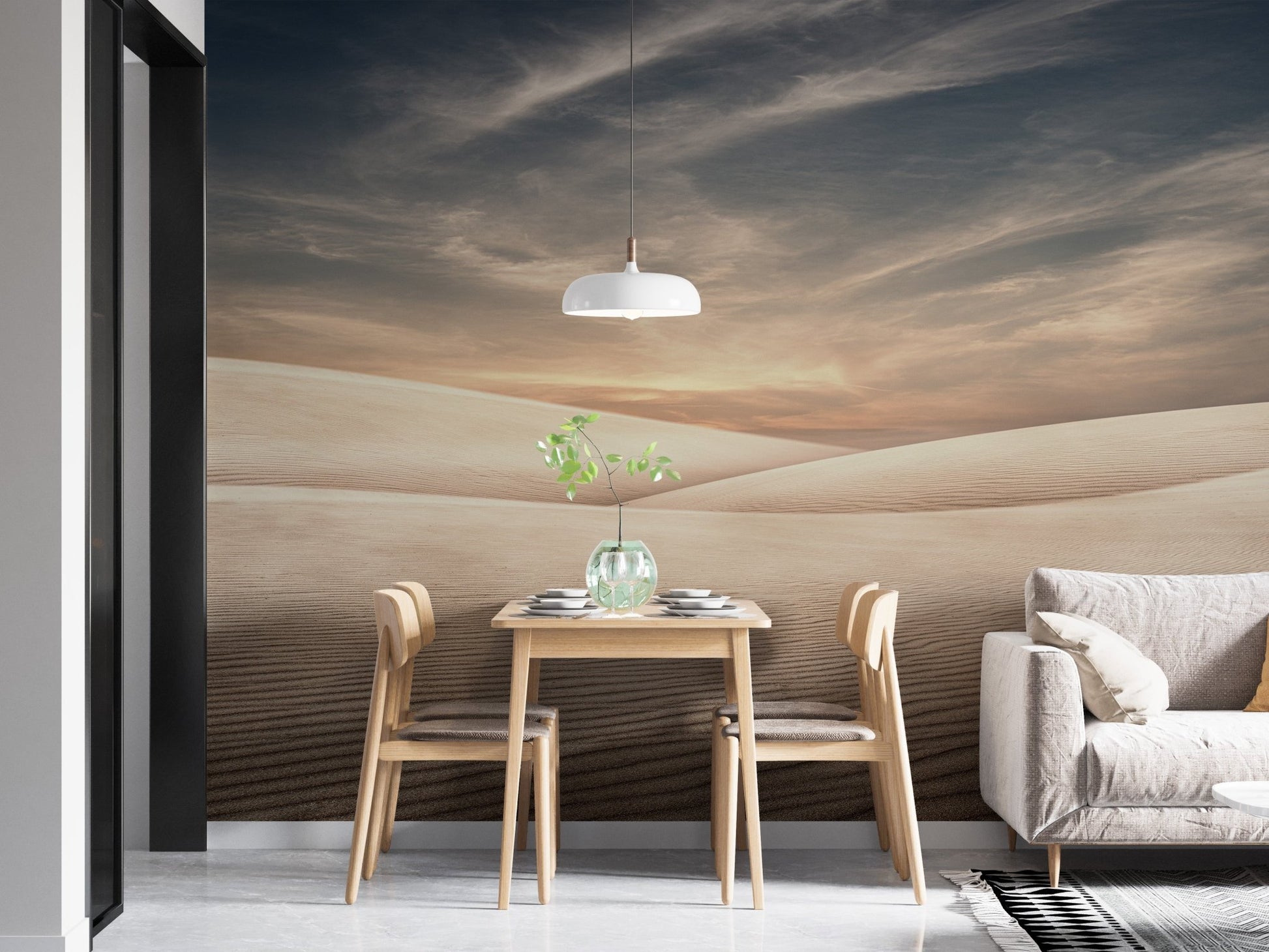 Small dining area wall mural with a desert dunes and light wood furniture.