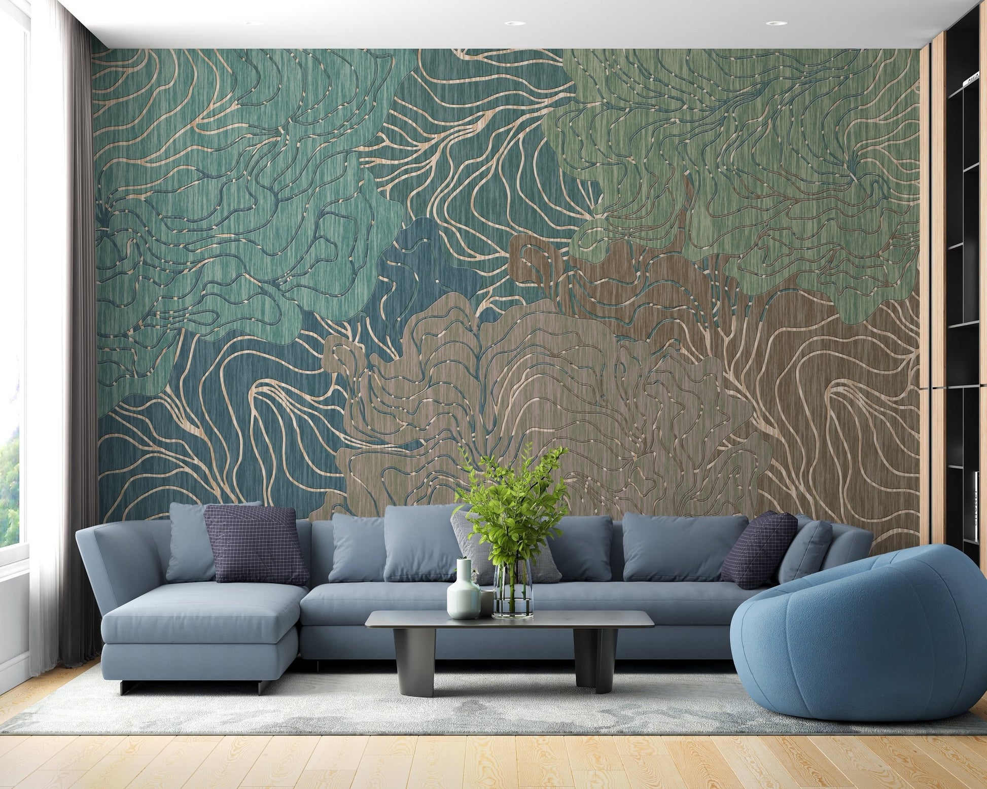 Blue sectional sofa in bright living room with teal kaleidoscope wall mural.