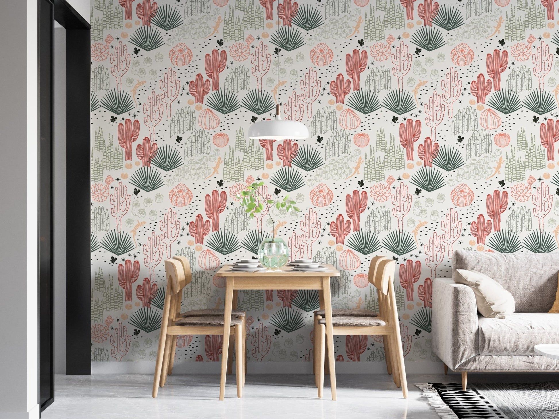 Dining room with desert landscape wallpaper and light wood furniture.