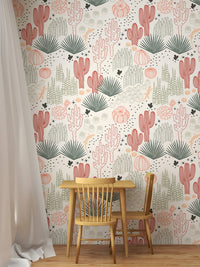 Kids dining area featuring a wooden table and Mexican cacti wallpaper.