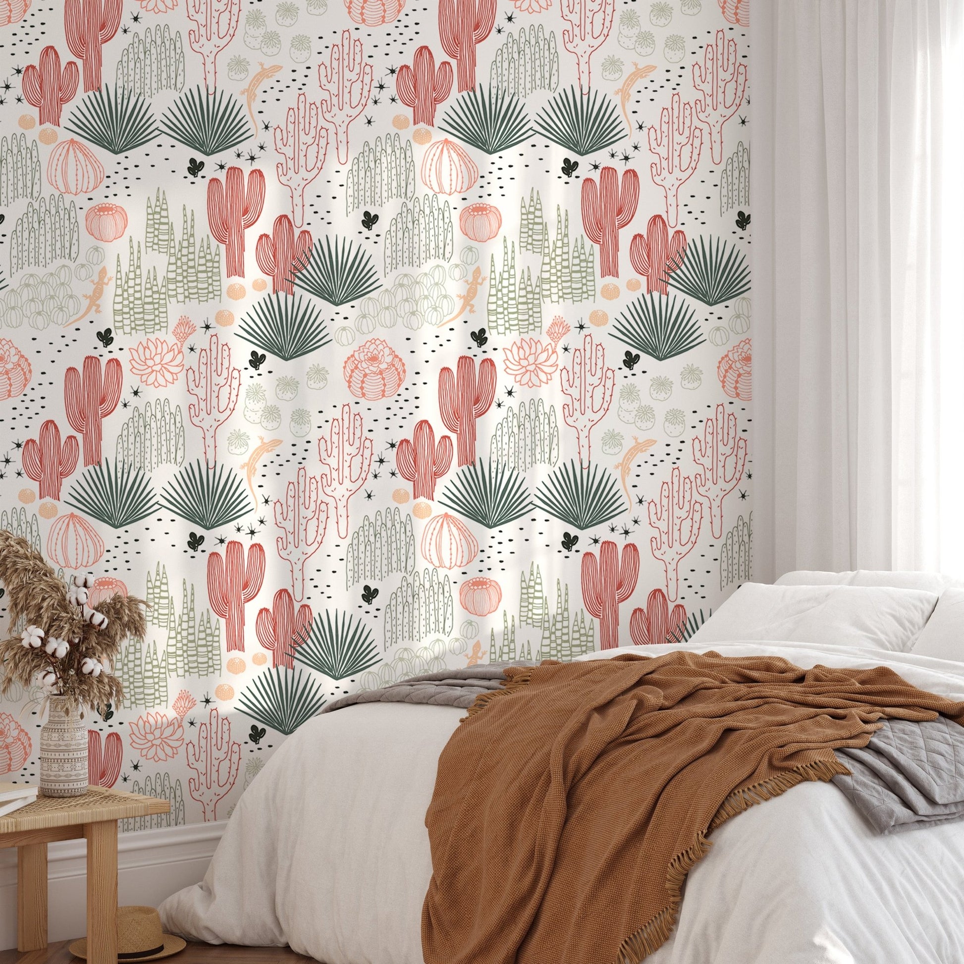 Desert landscape wallpaper in a bedroom featuring white bedding and a brown shawl.