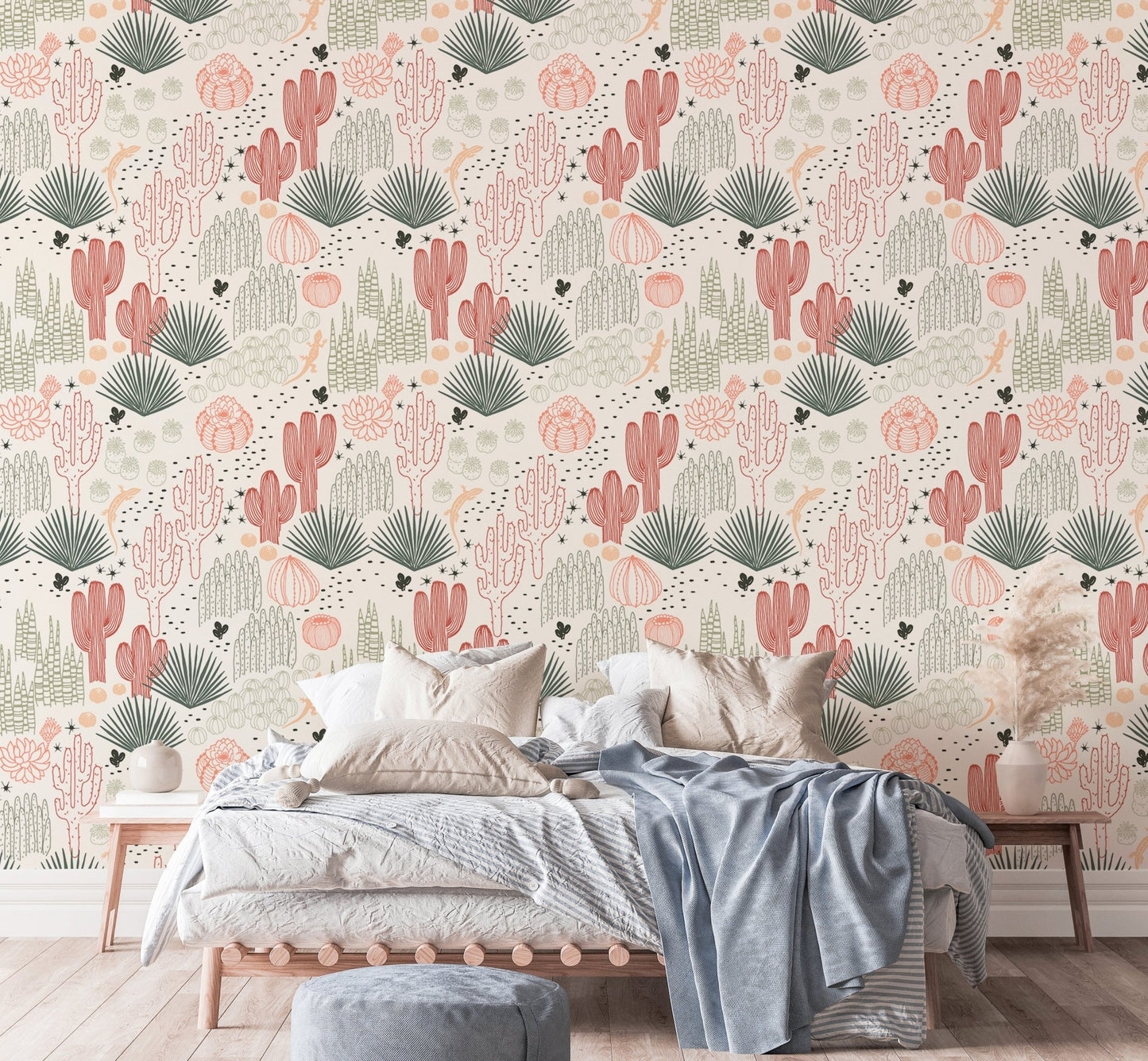 Cacti and lizard wallpaper in a modern bedroom with a blue throw blanket.