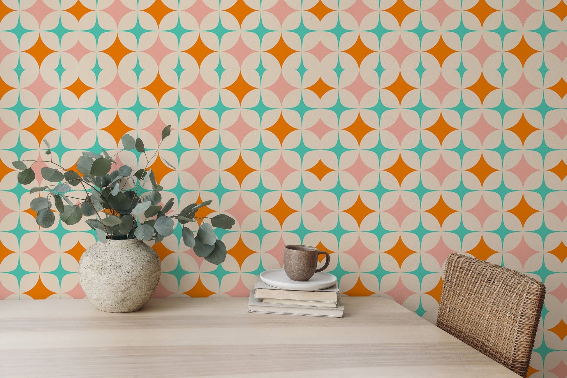 Retro pattern wall mural in a dining space with a wooden table and green plants.