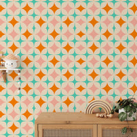 Retro starburst pattern wall mural behind a wooden sideboard and minimalist decor.