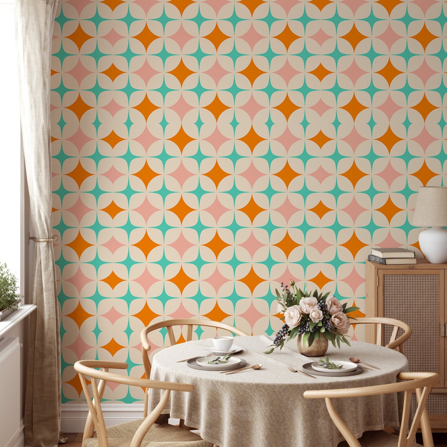 Starburst pattern wall mural in a breakfast nook with a round table and wooden chairs.