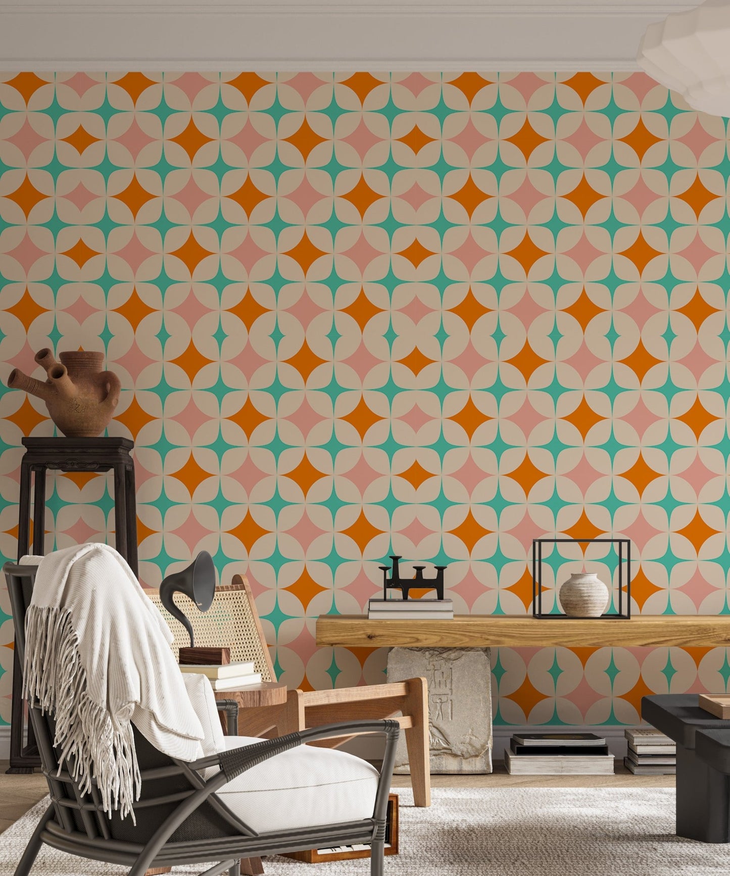 Retro geometric art wall mural in a living room with a white armchair and desk lamp.