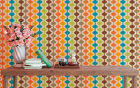 Vertical atomic pattern wall mural on a study room wall with a wooden desk.