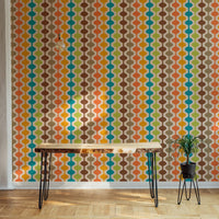 Geometric retro mural used as a feature wall in a minimalist home office.