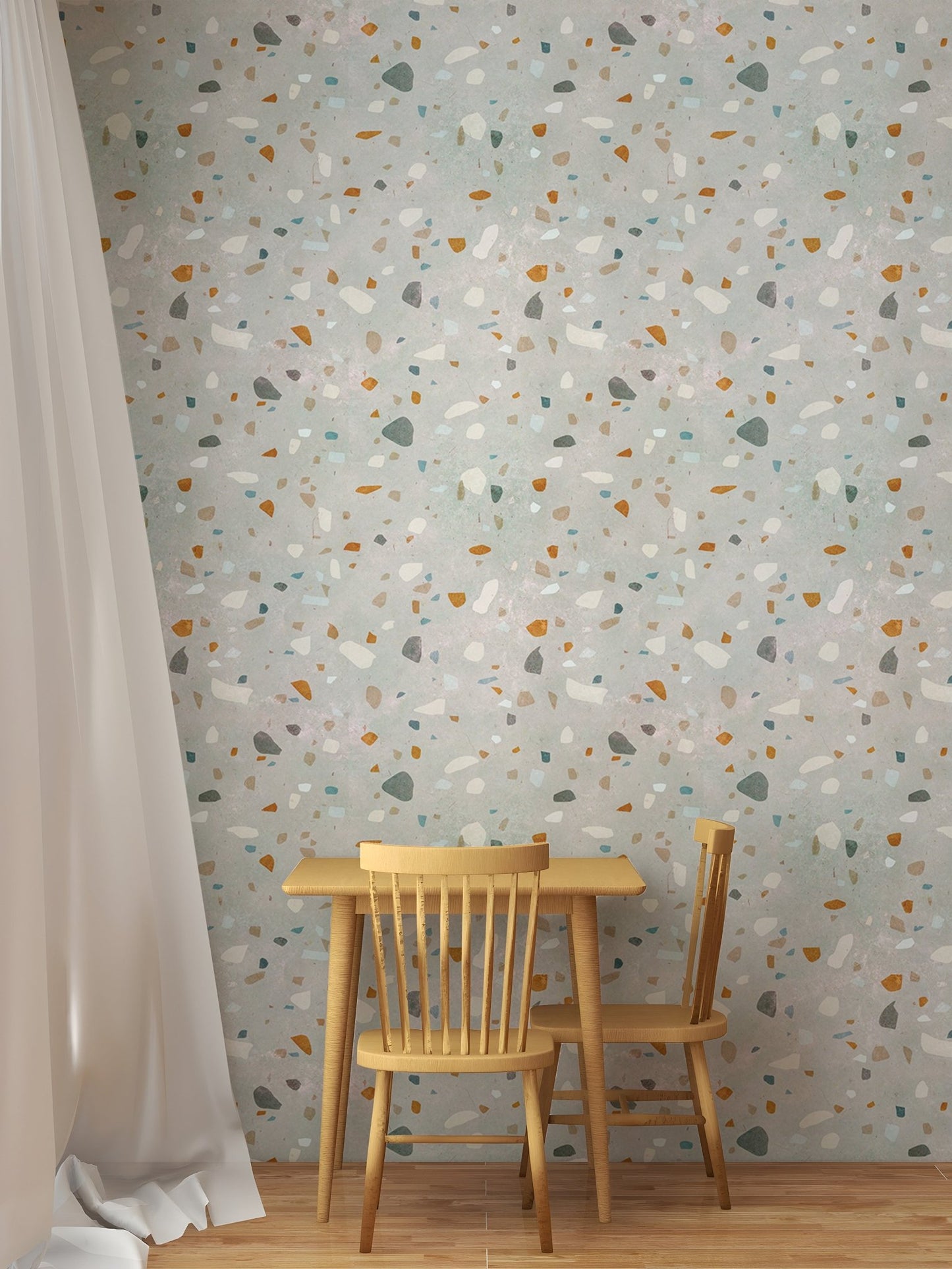 Small dining table and chair set against a multi-color terrazzo wallpaper background.