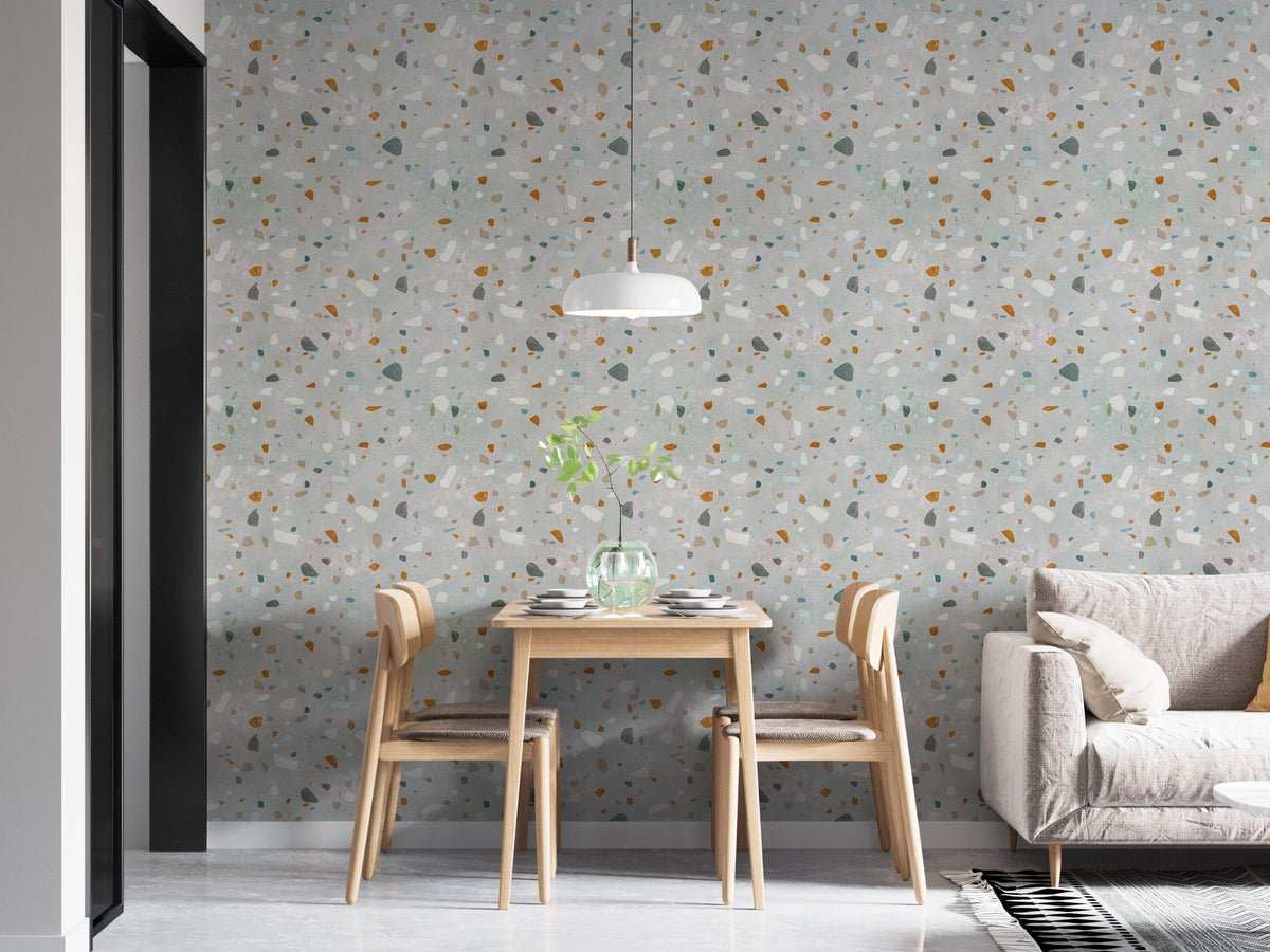 Mid century modern natural classic terrazzo wallpaper in a dining area with wooden chairs.