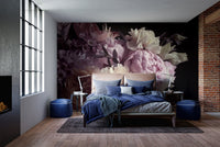 Large purple floral garden wall mural in a bedroom with blue bedding.