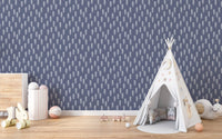 Blue and white pine tree wallpaper for toddler room with teepee tent.