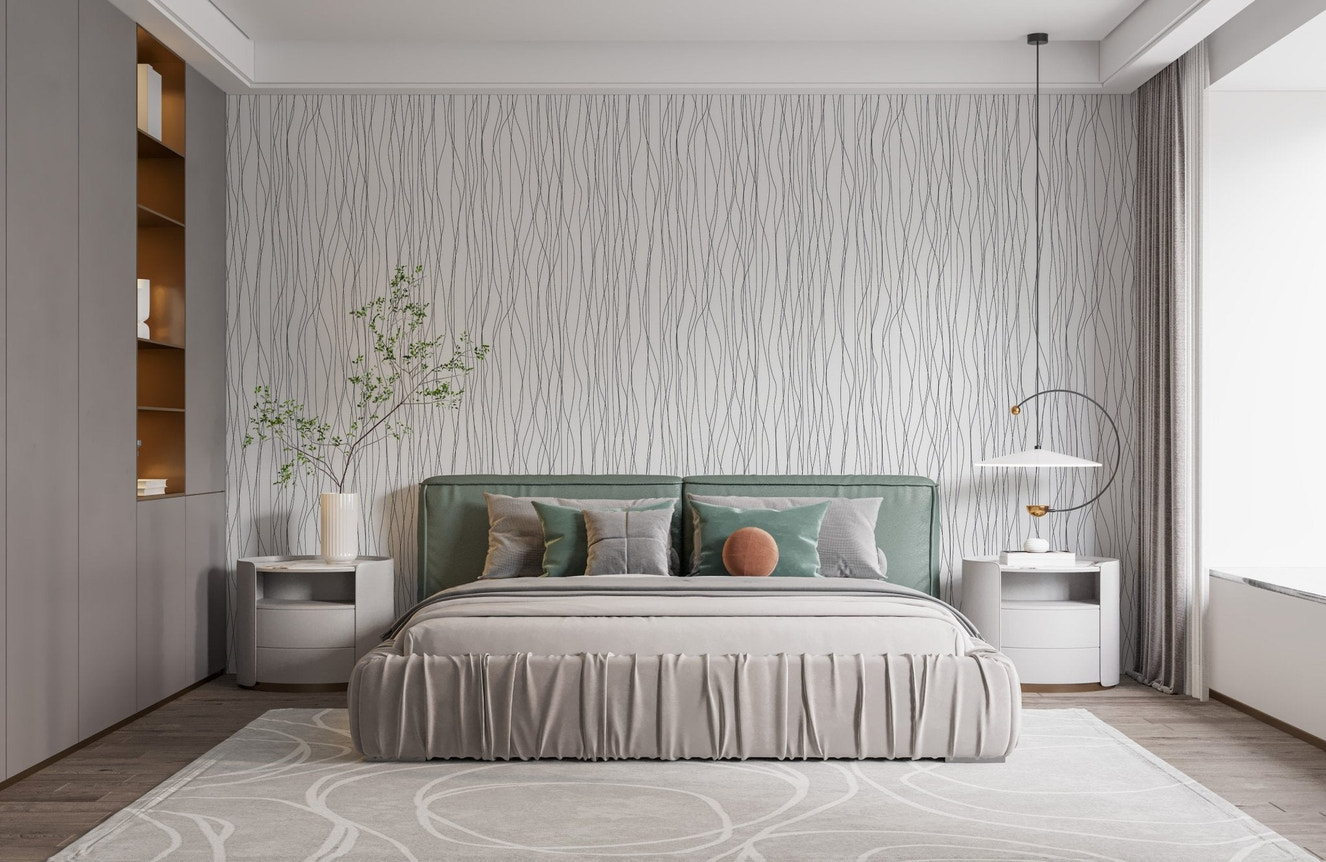 Bedroom wallpaper featuring white curved patterns and a green upholstered bed.