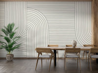 Abstract line pattern wall mural in a dining room with wooden furniture.