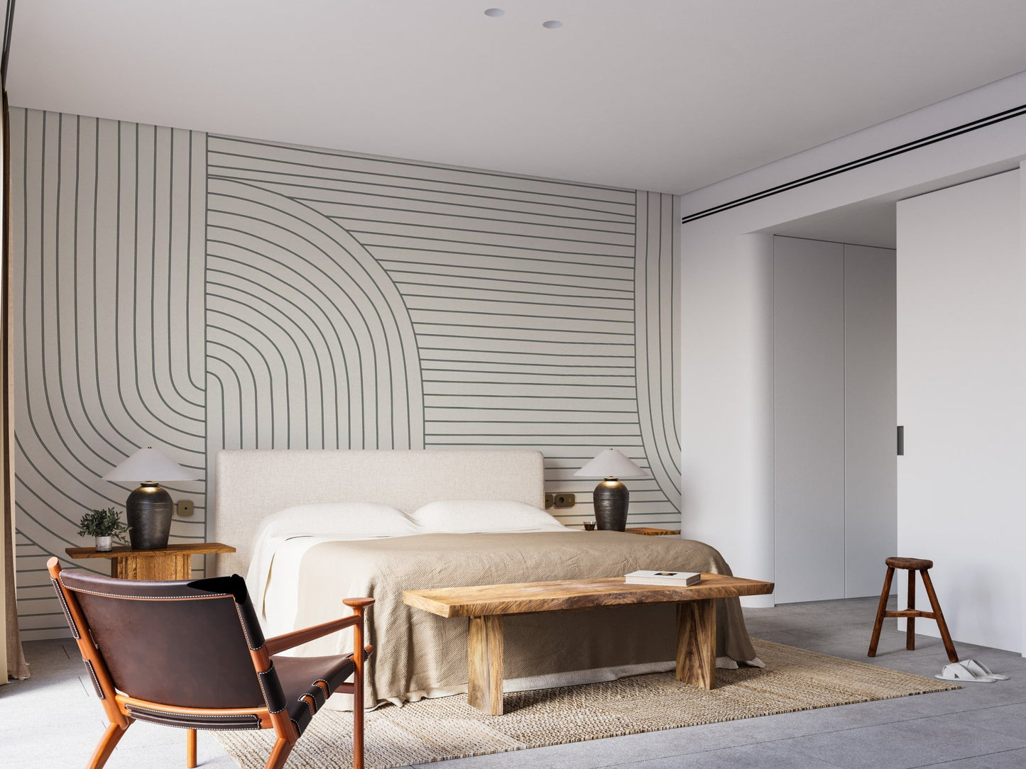 Modern line art mural in a spacious bedroom with a wooden bench.