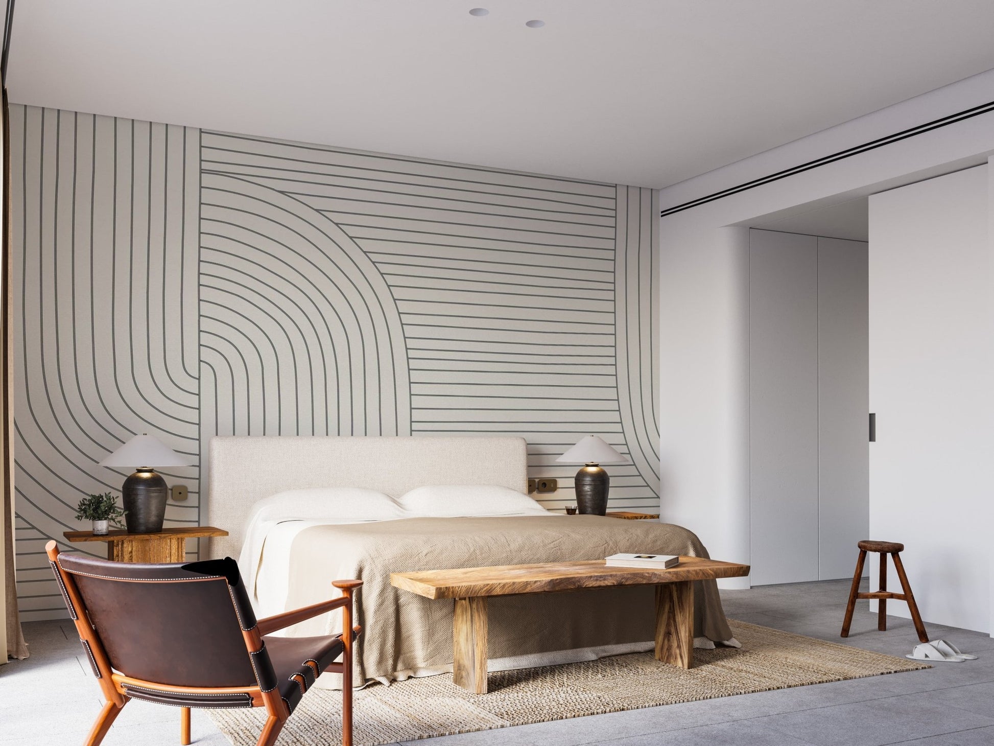 Modern line art mural in a spacious bedroom with a wooden bench.