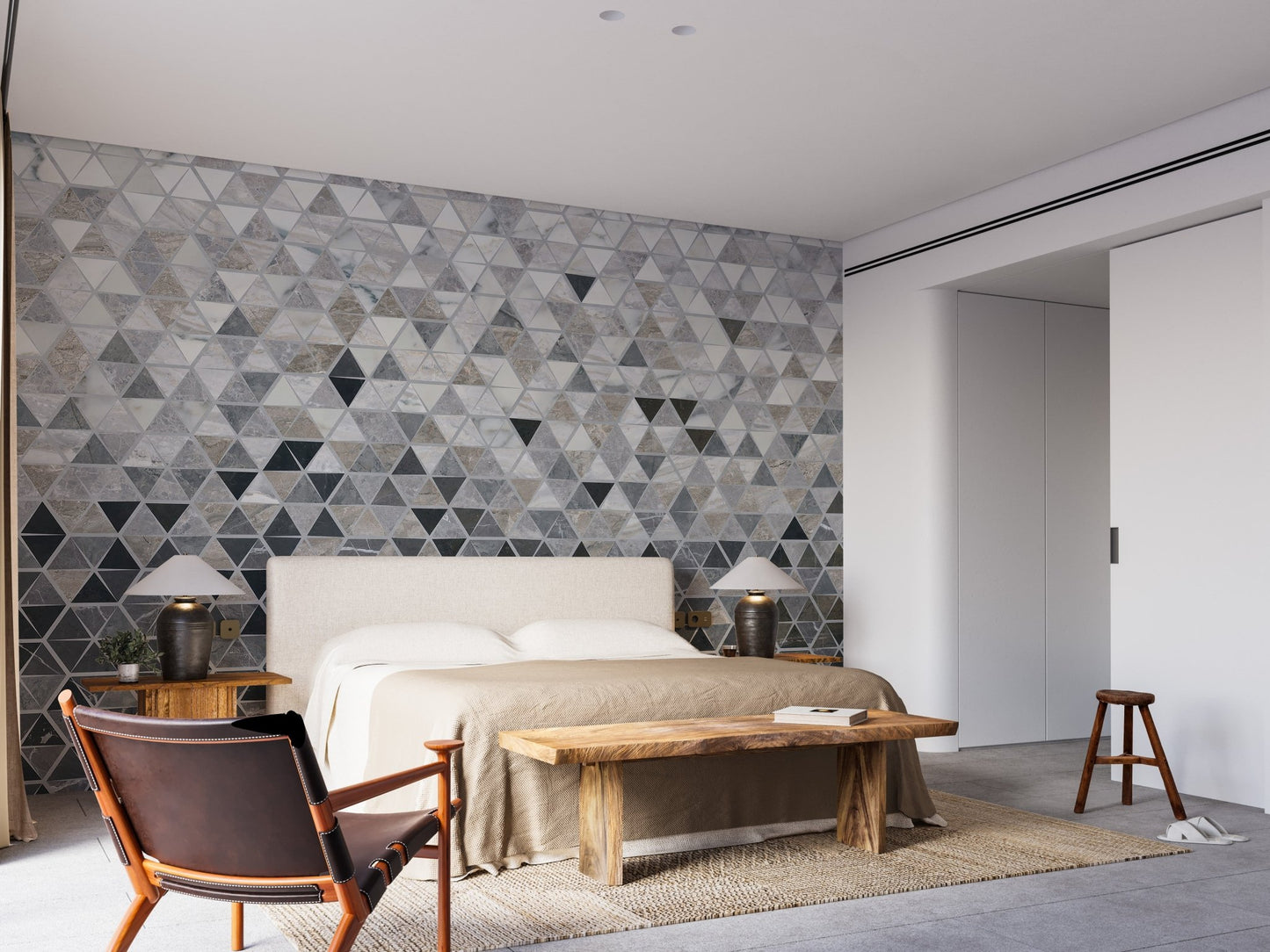 Symmetrical tile effect wall mural behind a bed in a contemporary bedroom.