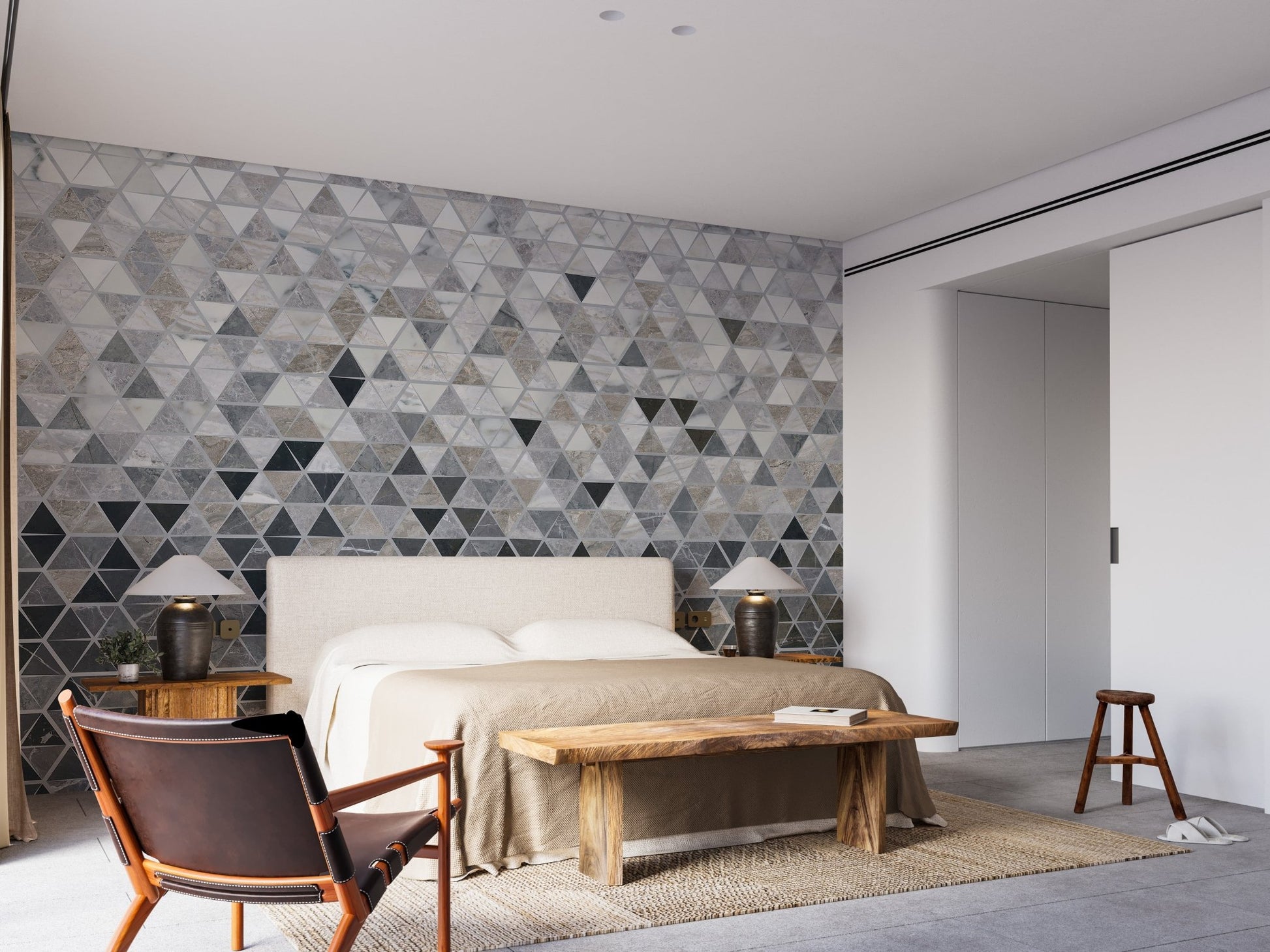 Symmetrical tile effect wall mural behind a bed in a contemporary bedroom.