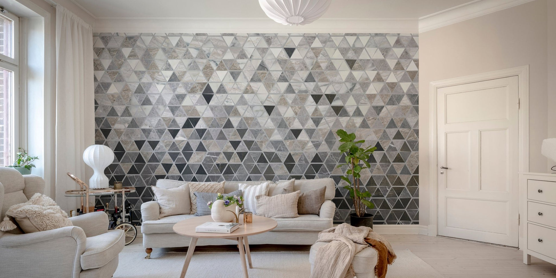 Sleek geometric mirror tile wall mural design in living area.