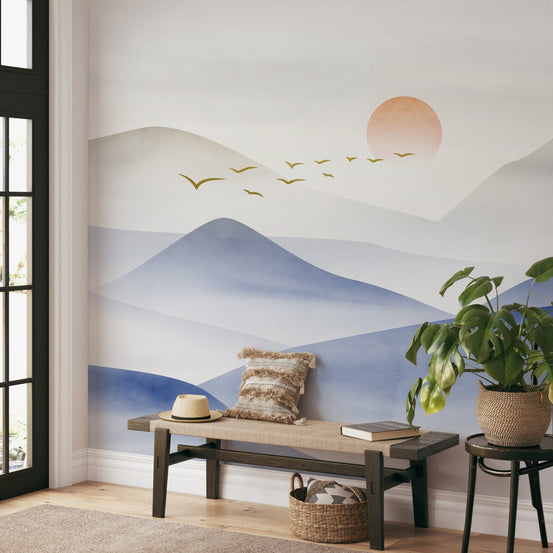Nature-themed blue wallpaper with hazy mountain silhouettes.